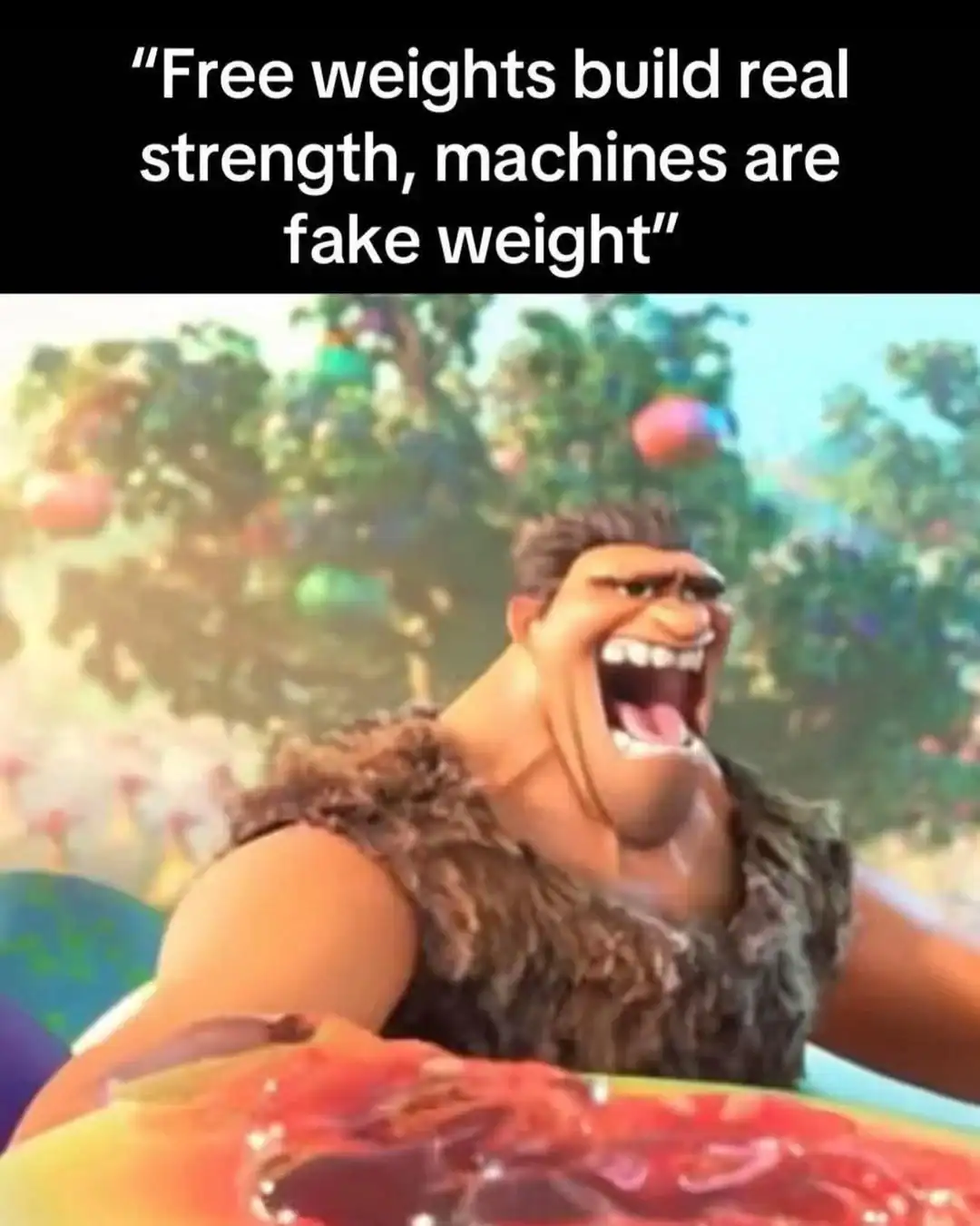 funny workout meme showing Grug from the animated movie The Croods to perfectly represent the caveman logic of gym bros who aggressively claim free weights build real strength while machines are just fake weight in this classic gym meme