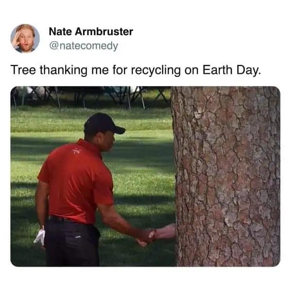 A surreal 2026 Earth Day meme featuring a famous photo of Tiger Woods shaking hands with a large tree. The perspective makes it look like a human hand is emerging from the bark to thank him, captioned as a tree showing gratitude for recycling.