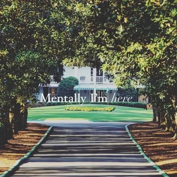 iconic 2026 Masters meme featuring the sun-dappled drive of Magnolia Lane leading toward the Augusta National clubhouse. The elegant serif text overlay reads, "Mentally I'm here," capturing the escapism of golf fans everywhere during tournament week