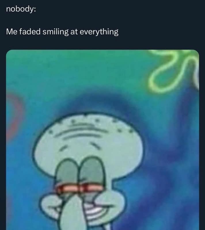 A dazed Squidward from SpongeBob SquarePants stars in this subtle 420 meme. He is shown with intensely bloodshot eyes and a content, slightly frozen smile against a psychedelic blue background, capturing the specific mood of smiling at everything for no reason.