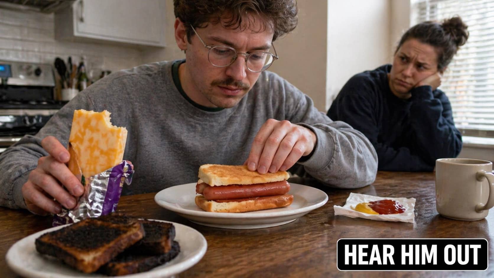 Man eating a hot dog sandwich with white bread while a woman looks on judgmental.