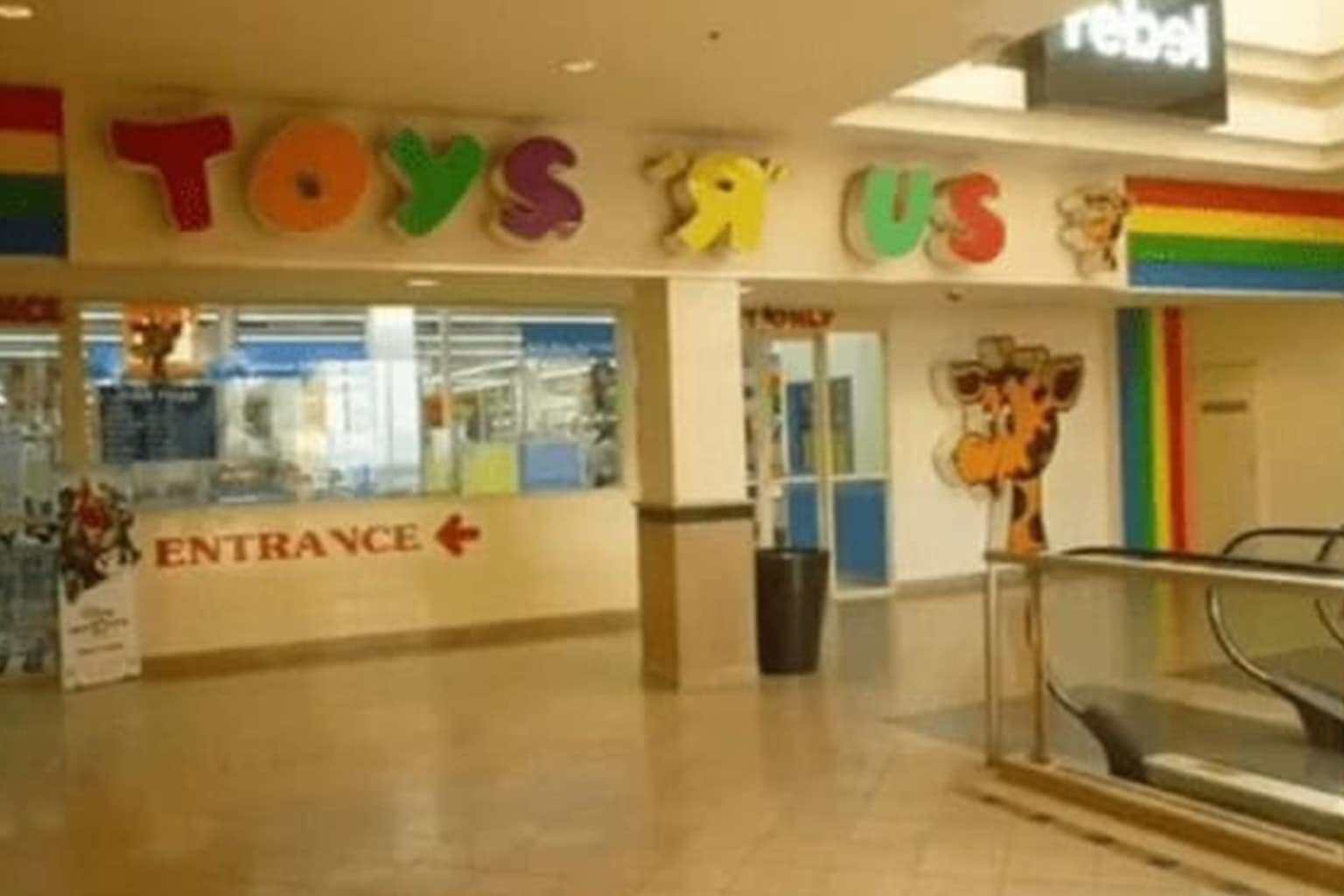 A gallery of 90s mall glamour shots featuring a food court with vintage Taco Bell and Häagen-Dazs signs, a giant Bugs Bunny Statue of Liberty at the Warner Bros. Store, and a tiered brick fountain surrounded by neon storefronts.