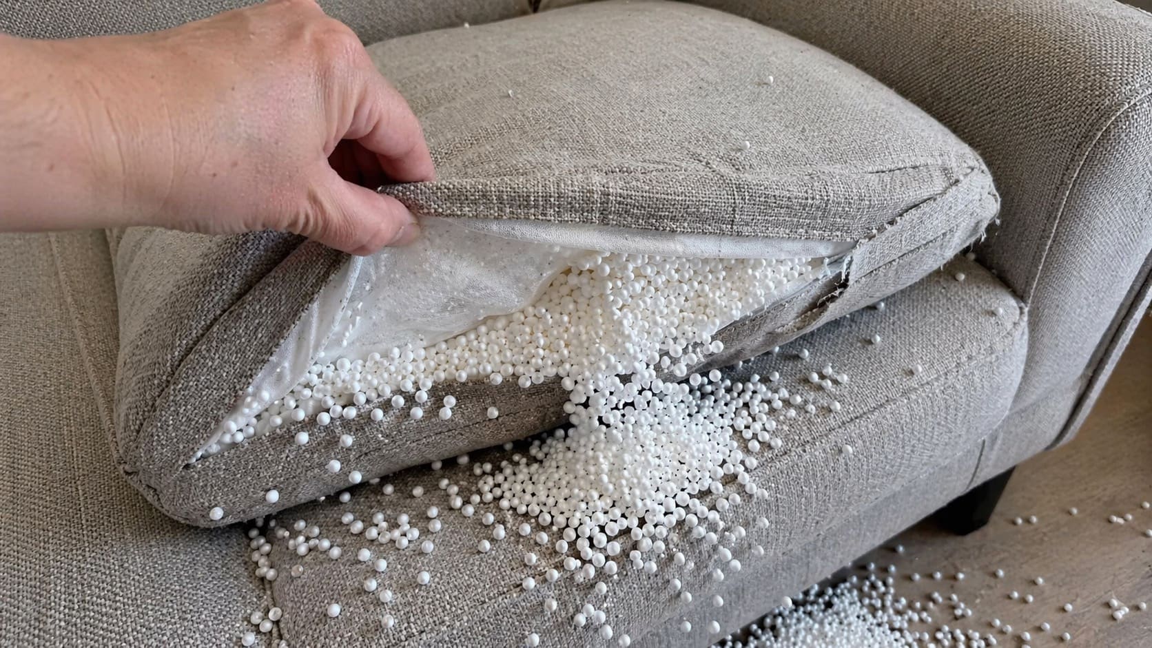 Beads spilling from torn cushion cover