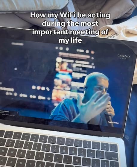 relatable Bieberchella meme showing a blurry, pixelated Coachella livestream on a laptop screen. The caption compares the poor stream quality to a universal frustration: "How my WiFi be acting during the most important meeting of my life."