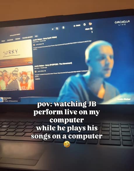 A meta Bieberchella meme showing a POV shot of a laptop screen displaying the Coachella livestream. On the stage behind Bieber, a browser window is visible. The text reads: "pov: watching JB perform live on my computer while he plays his songs on a computer 🤣."