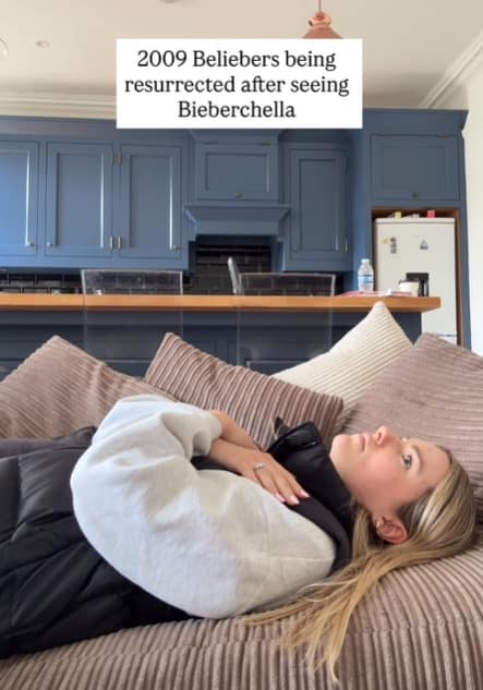 A relatable Bieberchella meme showing a young woman lying flat on her back on a brown corduroy couch, staring blankly at the ceiling in a state of shock. The caption reads: "2009 Beliebers being resurrected after seeing Bieberchella."
