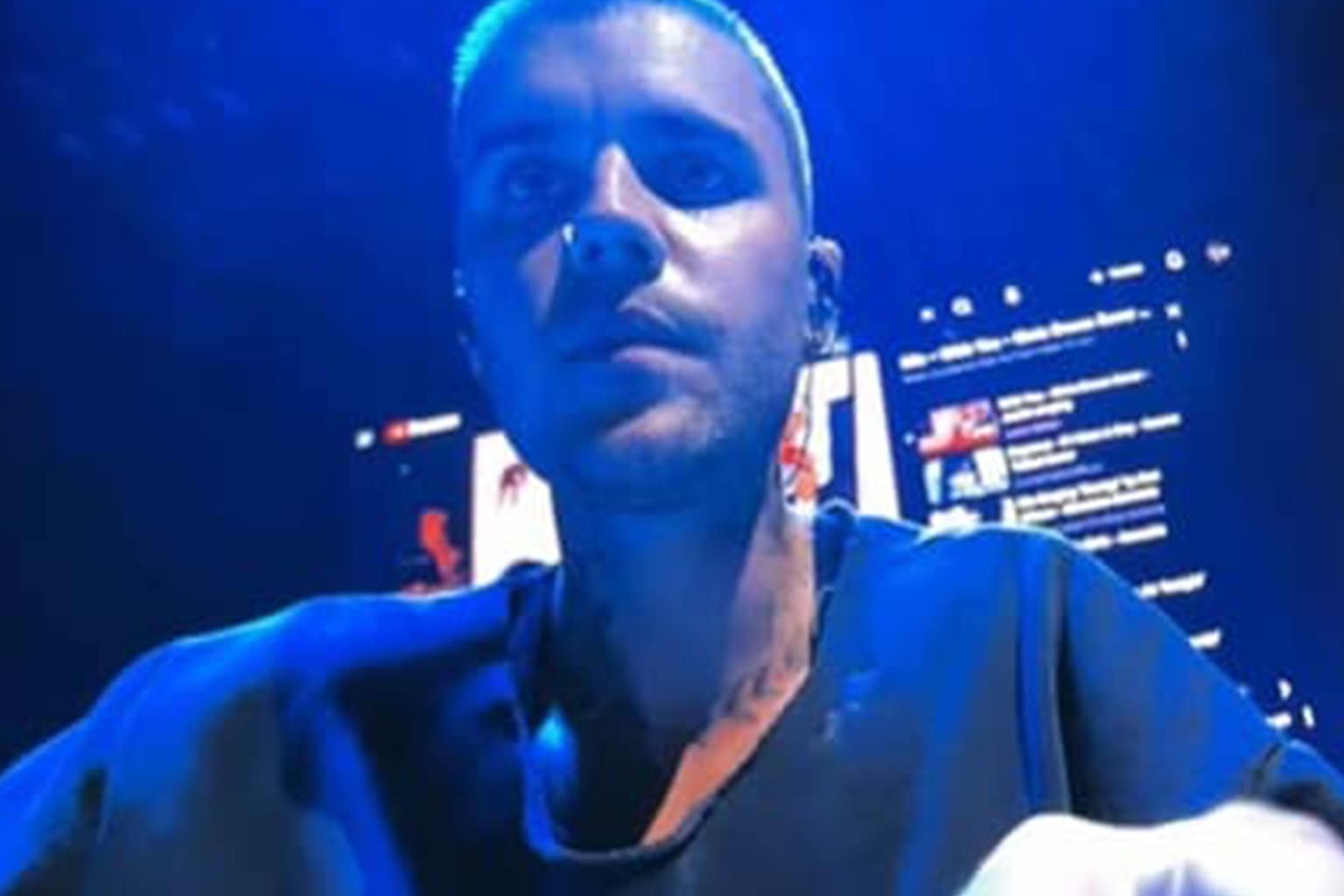 A Bieberchella memes dump from Coachella 2026 featuring a young Bieber vs. his 2026 self sitting at a desk "updating his own meme," a fan crying in bed with a toilet roll while watching the stream, and Bieber leaning into the stage camera like a tech support agent asking, "Ok can everyone see my screen?"