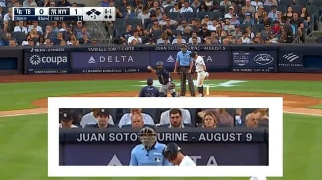 A baseball broadcast capture where a stadium ad for a "JUAN SOTO FIGURINE" on August 9 is obscured by the umpire’s head, leaving the text "JUAN SOTO URINE" visible across the blue outfield padding.