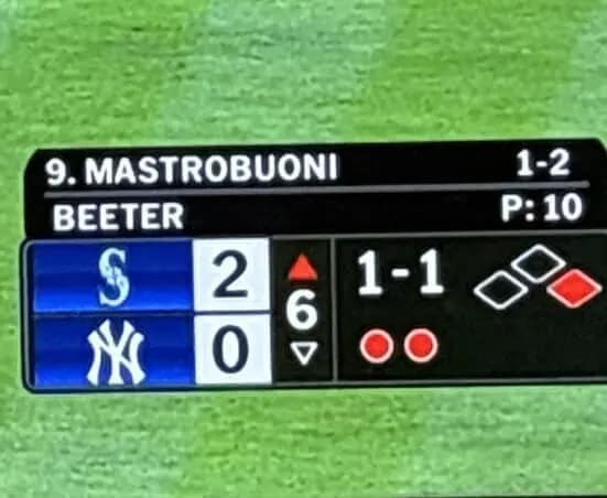 An accidentally funny sports graphic from a Mariners vs. Yankees game featuring the names of hitter Mastrobuoni and pitcher Beeter, which phonetically combines into a very suggestive and unfortunate phrase on the screen.
