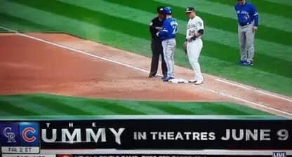 A hilarious broadcast glitch where a promotion for the movie "THE MUMMY" is overlapped by the circular blue "C" logo for the Chicago Cubs