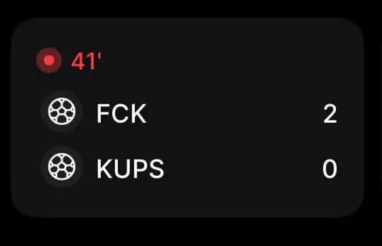 An accidentally funny sports graphic showing a soccer score bug between the teams "FCK" (FC Kaiserslautern) and "KUPS," spelling out a profane-sounding phrase at the top of the dark screen.