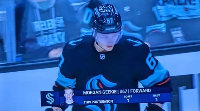 A broadcast still of hockey player Morgan Geekie of the Seattle Kraken. A stat bar at the bottom labeled "THIS POSTSEASON" lists his performance metrics as "GOALS: 1" and, inexplicably, "BABY: 1."