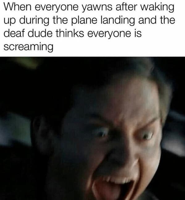 hilarious airplane meme featuring a zoomed-in, distorted shot of Tobey Maguire’s Peter Parker screaming in terror. The caption jokes about a deaf passenger being horrified when everyone on the plane simultaneously yawns upon landing, mistaking the silent gesture for a collective scream.