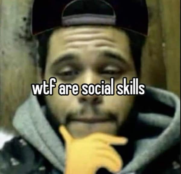 A mood-driven anxiety meme featuring a contemplative photo of The Weeknd with a yellow "thinking" emoji edited over his hand. The bold text overlay simply asks the ultimate question for the socially anxious: "wtf are social skills."