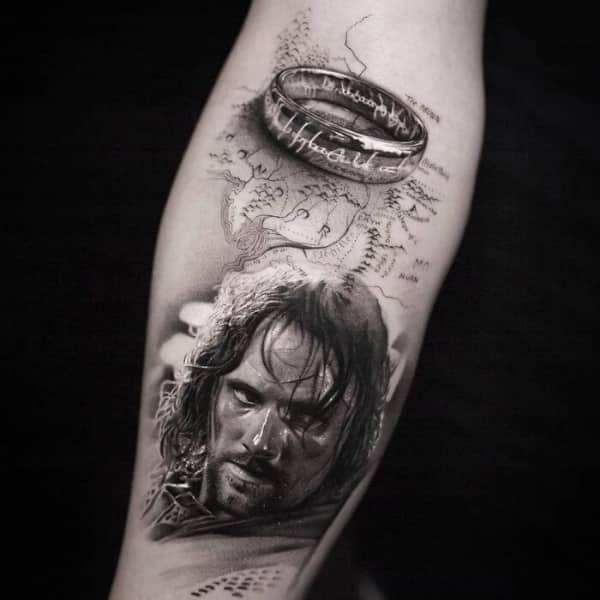 Lord of the Rings tattoo featuring a realistic portrait of Aragorn, the One Ring, and Middle-earth map.