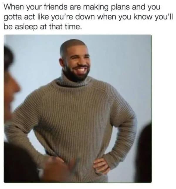 An awkward meme featuring Drake in a thick grey turtleneck, smiling with forced politeness and his hands on his hips. The caption hits home for the chronically tired: "When your friends are making plans and you gotta act like you're down when you know you'll be asleep at that time."