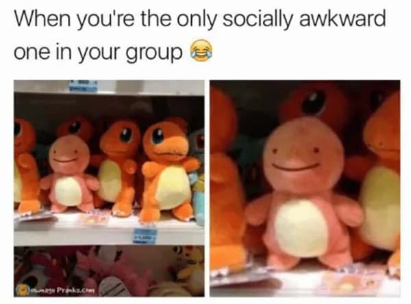 A visual awkward meme comparing a shelf of plush Pokémon. While all the other Charmanders look normal, one has the tiny, flat dot-eyes of a Ditto transformed into a Charmander. The caption reads: "When you're the only socially awkward one in your group