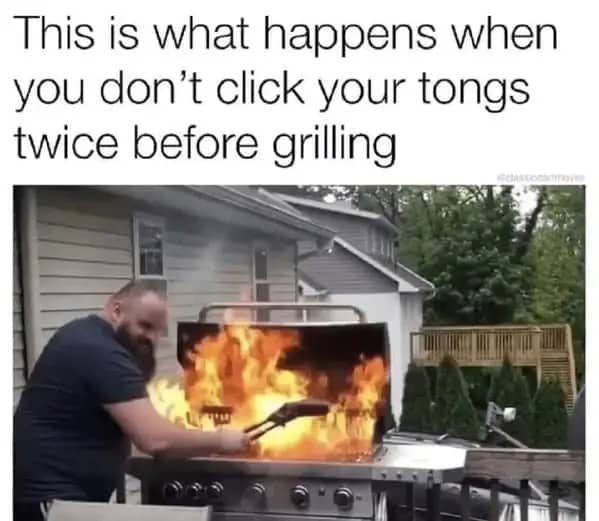 Man grilling on a deck with huge flames appearing after not clicking tongs twice.