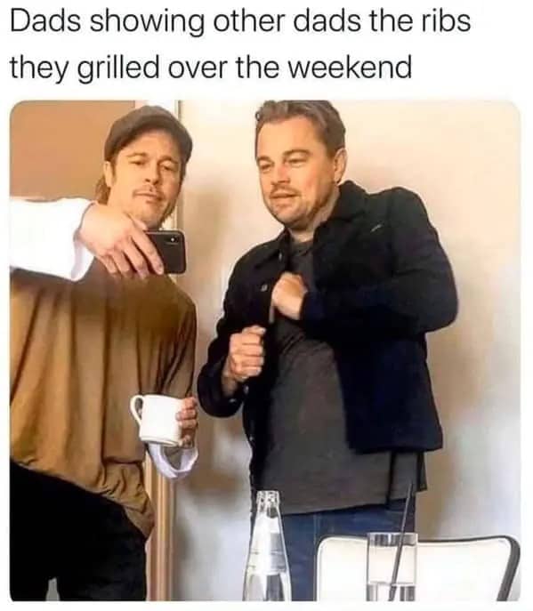 Brad Pitt and Leonardo DiCaprio looking at a phone screen representing dads sharing rib photos.