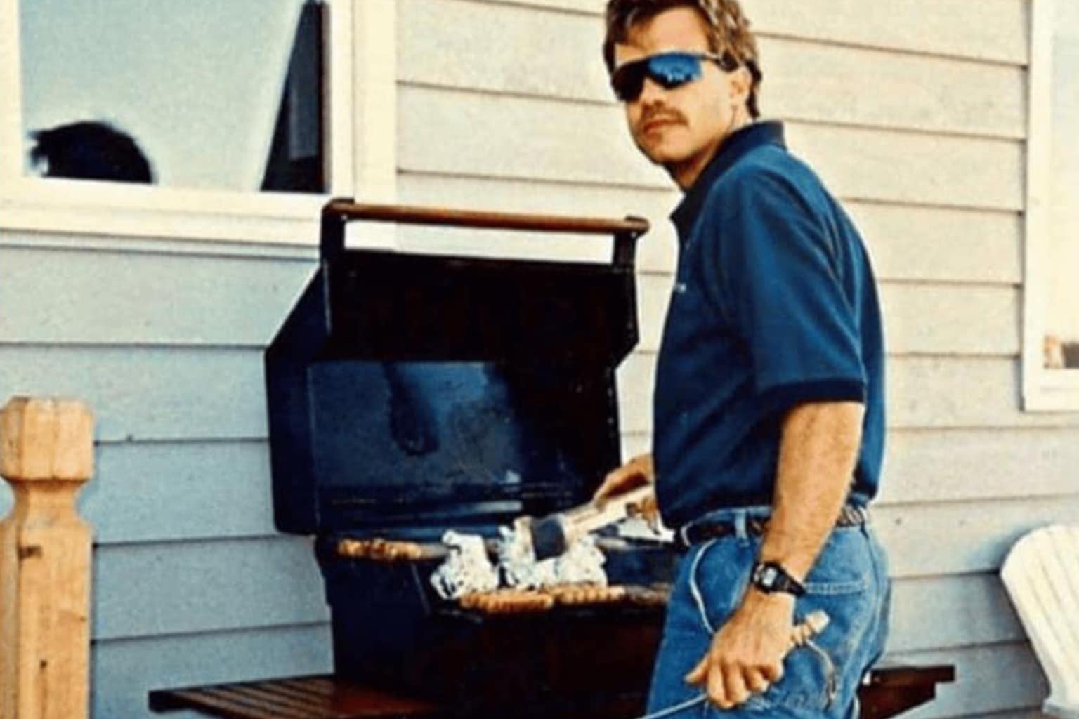 A comprehensive bbq memes gallery exploring the nuanced rituals of suburban cookouts, featuring Tony Soprano lighting a match over a kettle grill, a high-octane photo of a grill bolted to the side of a house outside a second-story window, and a 90s dad sporting the "Final Boss" uniform of denim shorts and white New Balance sneakers.