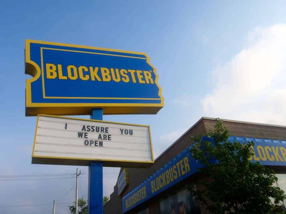 Real Blockbuster store marquee sign reading I assure you we are open defiantly