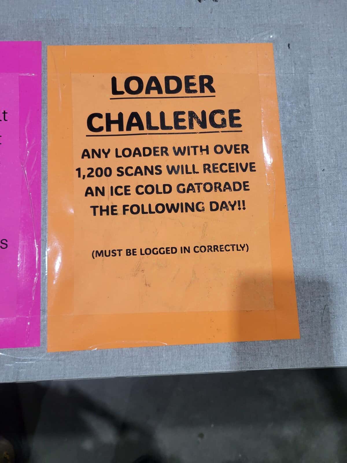 Orange workplace flyer promising warehouse loaders a Gatorade reward for scanning 1200 items correctly.