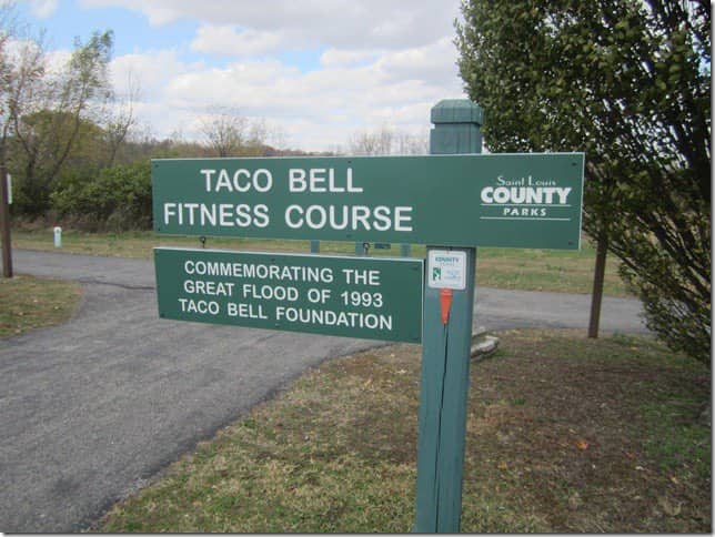 Saint Louis County park sign for Taco Bell Fitness Course commemorating the great flood of 1993.