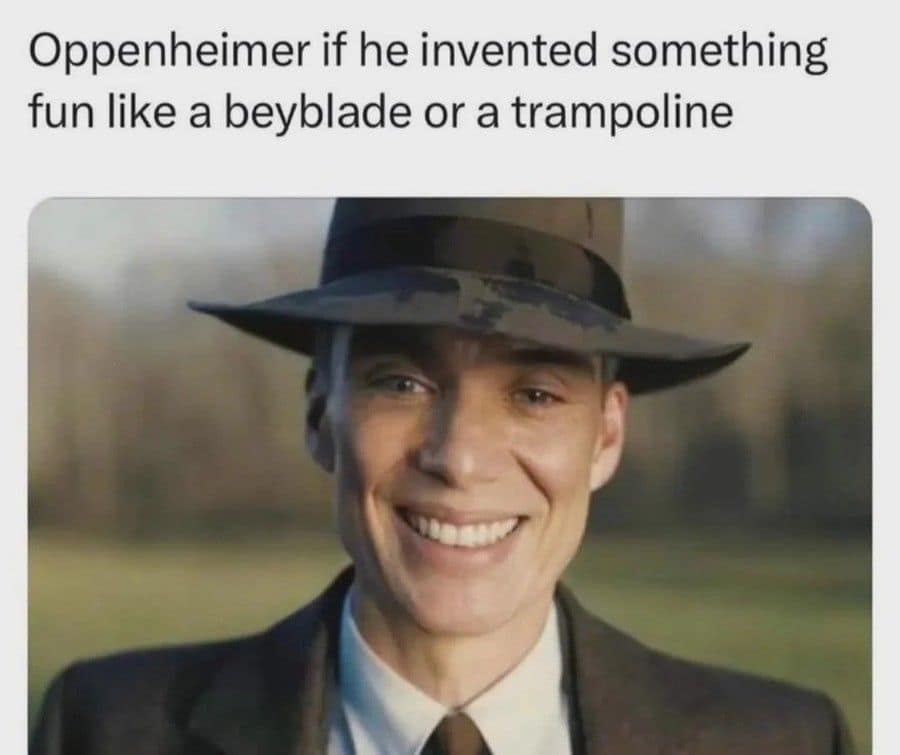 A classic meme edit of Cillian Murphy as J. Robert Oppenheimer. Instead of his haunting, weary expression, he is given an unnervingly bright, wide smile. The text suggests this is how he would have looked if he had invented something fun, like a "beyblade" or a "trampoline."