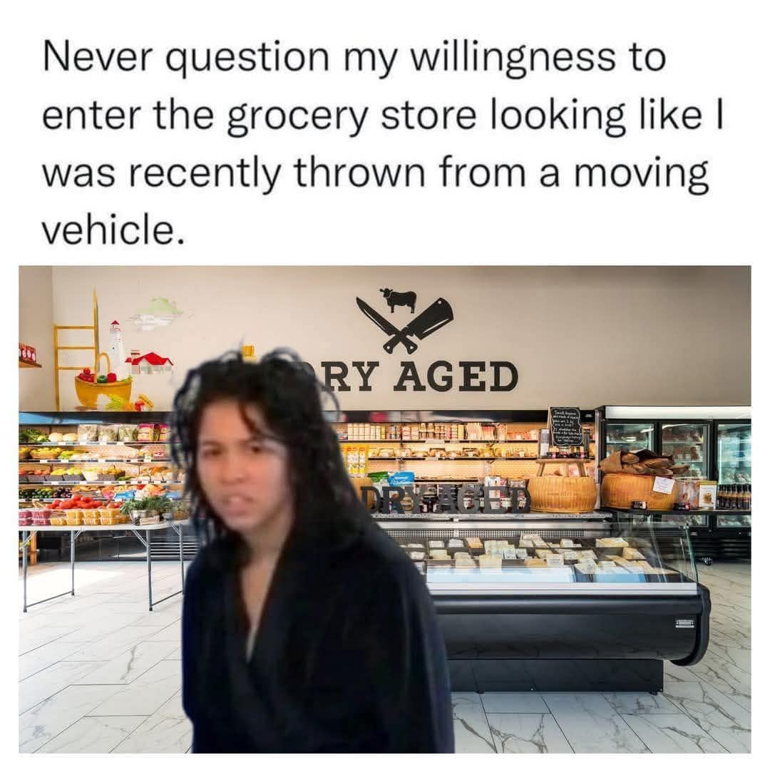 classic meme showing a person with extremely messy, wild dark hair and an exhausted expression superimposed over a fancy grocery store cheese counter. The text warns against questioning their willingness to shop while looking like they were just ejected from a speeding vehicle.