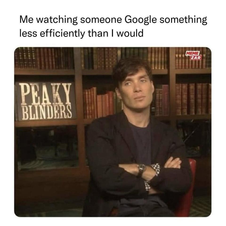 A classic meme featuring actor Cillian Murphy as Thomas Shelby in Peaky Blinders, looking deeply disappointed and exhausted with his arms crossed. The text describes the agony of watching someone perform a Google search far less efficiently than you would.