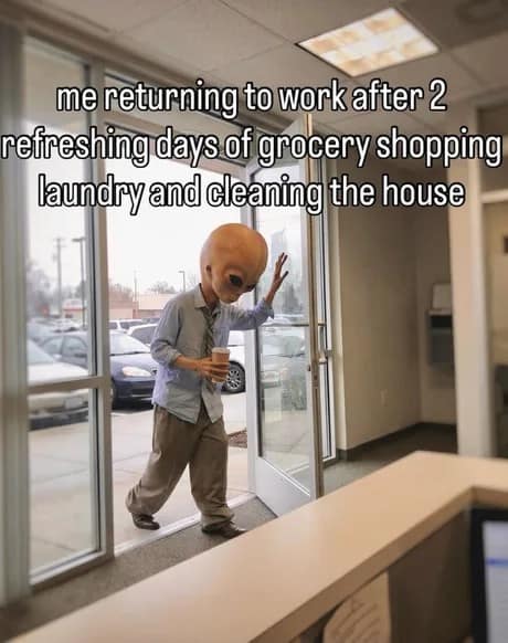relatable classic meme of an alien in a business suit and tie, clutching a cup of coffee and looking physically shattered while entering an office. The text describes returning to work after a weekend spent entirely on grocery shopping and laundry.