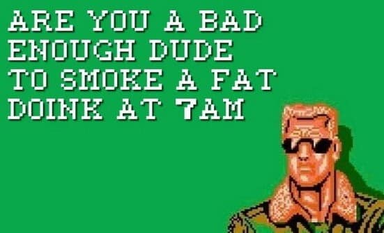 An 8-bit pixel art classic meme in the style of the NES game Bad Dudes. The blonde hero in sunglasses asks the iconic question: ARE YOU A BAD ENOUGH DUDE TO SMOKE A FAT DOINK AT 7AM.