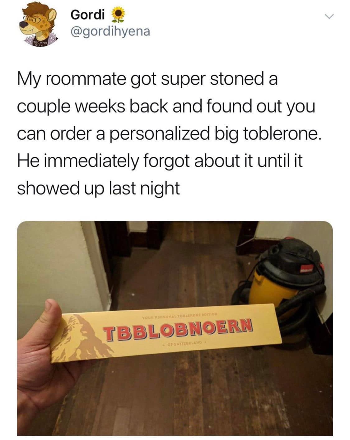 A legendary classic meme chronicling a "stoned purchase" gone wrong. A hand holds a personalized jumbo Toblerone bar that was supposed to have a name on it, but because the roommate was super high, the box arrived labeled "TBBLOBOERN" in giant red letters.