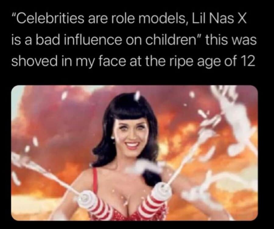cultural-critique classic meme contrasting the "bad influence" of Lil Nas X with childhood exposure to Katy Perry’s "California Gurls" era. It shows Katy Perry in a red bikini with whip-cream-dispensing canisters, captioned: "this was shoved in my face at the ripe age of 12."