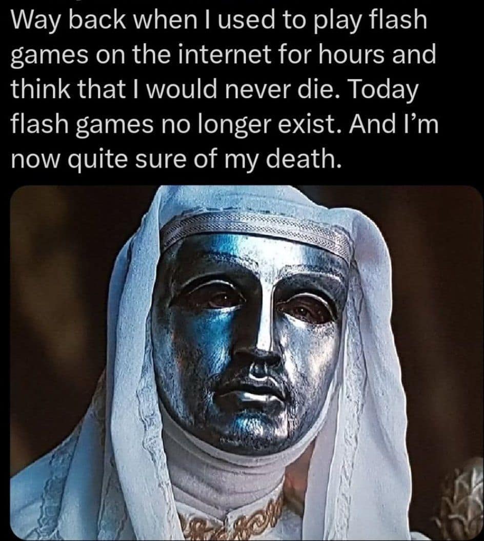 A somber classic meme using the silver-masked King Baldwin IV from Kingdom of Heaven to lament the end of an era; the text explains that the death of childhood internet Flash games has forced the user to confront their own mortality.