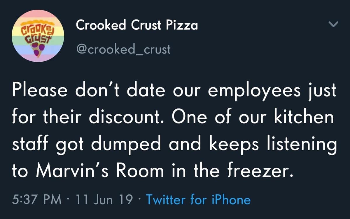 A brand-account classic meme tweet from Crooked Crust Pizza. It begs customers to stop dating employees for their discount, noting that a recently dumped kitchen staffer won't stop listening to Drake’s "Marvin’s Room" in the freezer.