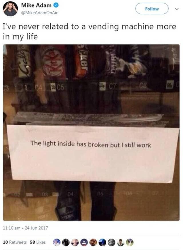 viral classic meme of a vending machine with a sign that reads, "The light inside has broken but I still work," used as a relatable metaphor for modern burnout and persistence.