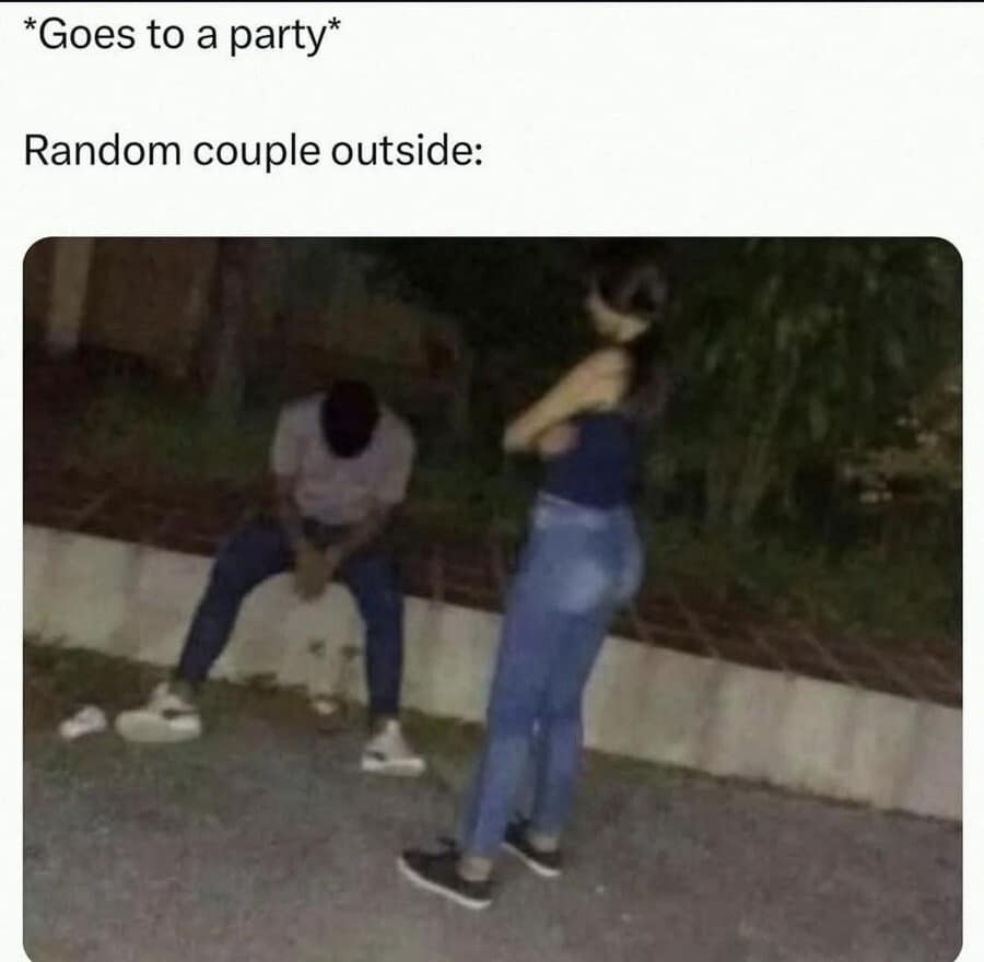 A gritty, low-resolution classic meme of a nighttime social scene. A girl stands with her arms crossed, looking down at a boy who is dejectedly sitting on a curb. The caption reads: "*Goes to a party* Random couple outside:", perfectly capturing the awkwardness of walking into someone else's drama.