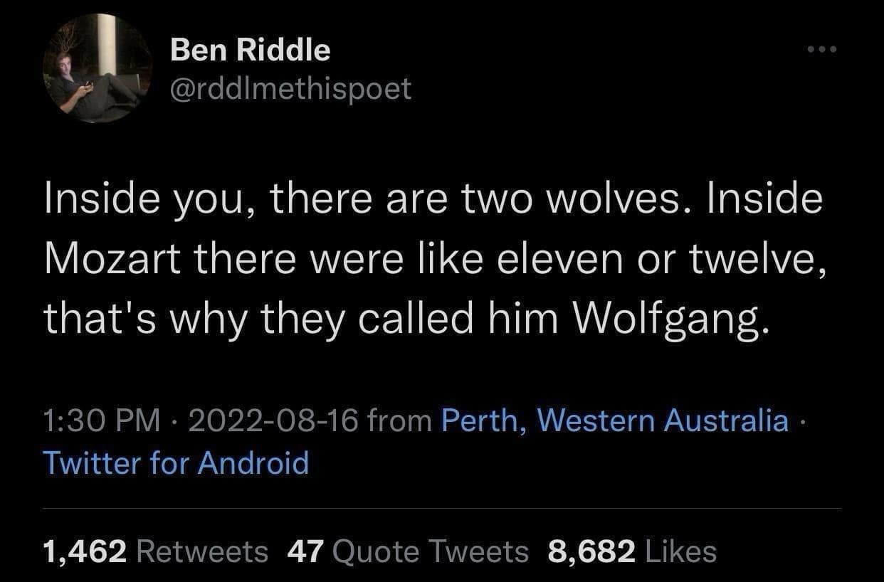 A clever text-based classic meme tweet from Ben Riddle. The joke riffs on the "two wolves" proverb, stating: "Inside you, there are two wolves. Inside Mozart there were like eleven or twelve, that's why they called him Wolfgang."