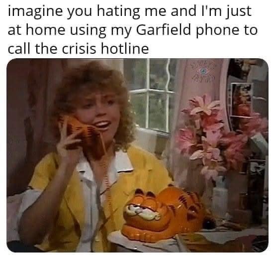 dark-humor classic meme showing a woman from an old commercial looking happy while talking on a Garfield novelty phone. The text reads: "imagine you hating me and I'm just at home using my Garfield phone to call the crisis hotline."