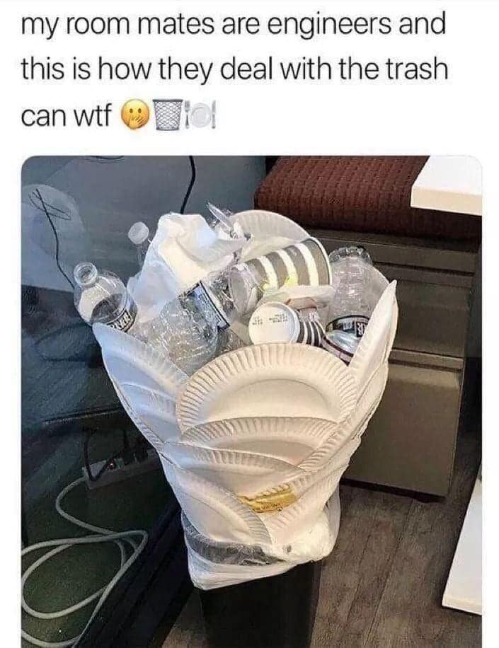A "life hack" classic meme showing a small office trash can overflowing with water bottles. To avoid emptying it, roommates have arranged paper plates vertically around the rim to double the height of the bin. The caption notes: "my room mates are engineers and this is how they deal with the trash can."