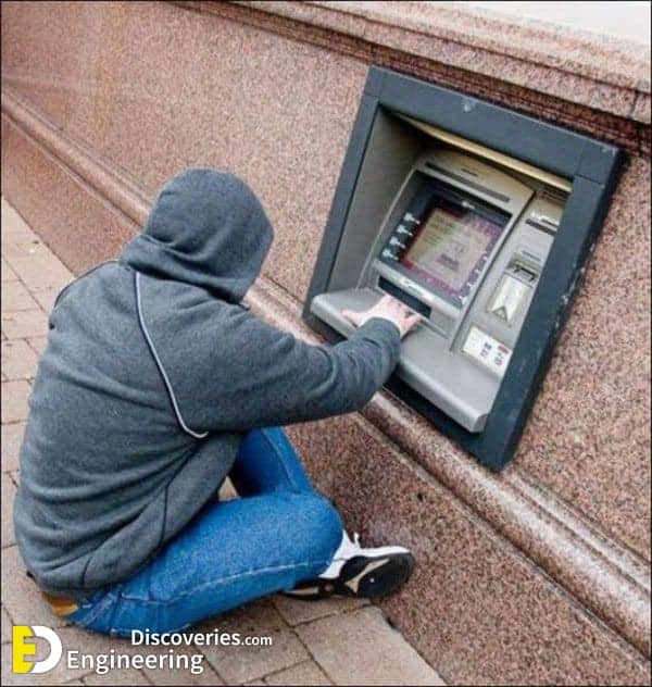 Person forced to kneel on ground to use ATM machine installed far too low on wall