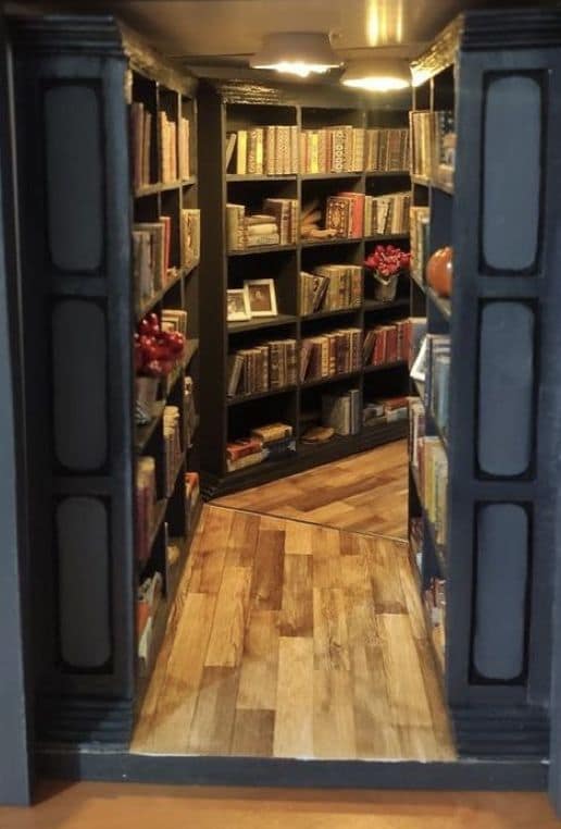 Cozy library nook cool bookends with polished hardwood floors and multiple rows of floor-to-ceiling bookshelves under warm overhead lighting.