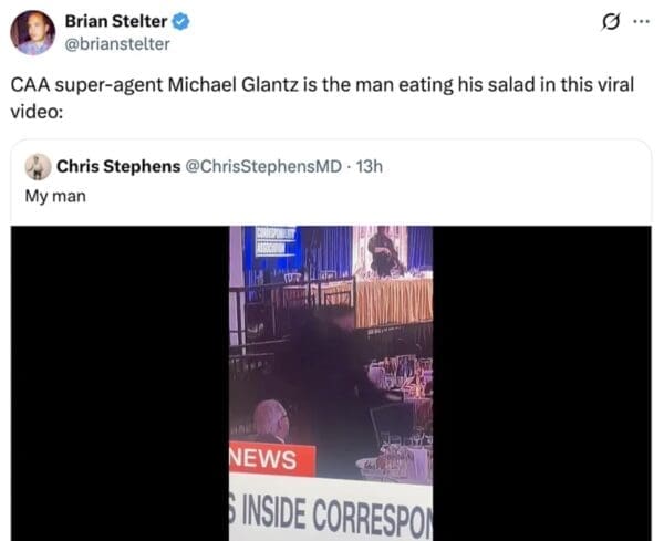 A screenshot of a tweet from Brian Stelter identifying a specific individual in a viral news clip. The text notes that "CAA super-agent Michael Glantz is the man eating his salad" during the incident, as seen in a grainy television still of a man calmly using a fork while security personal move in the background.