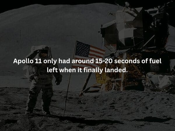 creepy fact overlaying a grainy photo of an astronaut saluting the American flag on the lunar surface. The text reveals that the Apollo 11 mission was mere heartbeats away from disaster, with only 15-20 seconds of fuel remaining when the Eagle finally touched down
