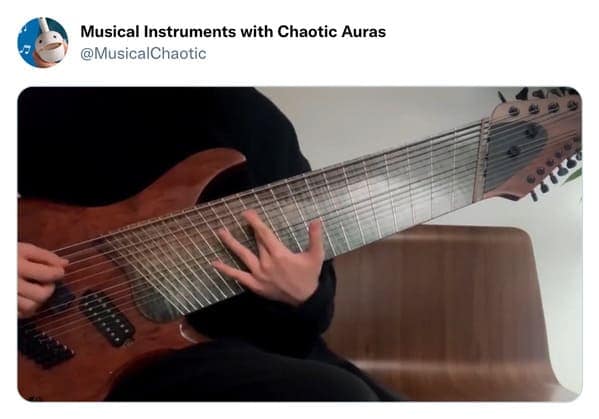 A wide-necked cursed instrument featured on the "Musical Instruments with Chaotic Auras" account. The electric guitar has an impossibly wide fretboard featuring approximately 18 strings, making a standard human hand look comically small and incapable of playing a single chord.