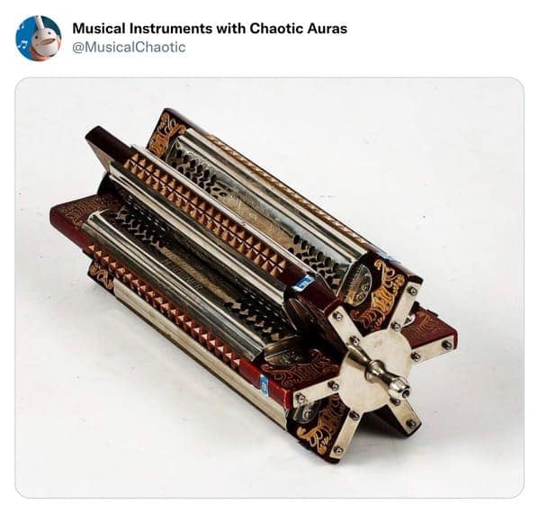 A complex cursed instrument wheel consisting of six harmonicas joined at their ends to form a star-shaped rotation device. This design theoretically allows a musician to switch between six different keys by simply spinning the wheel against their mouth mid-song.
