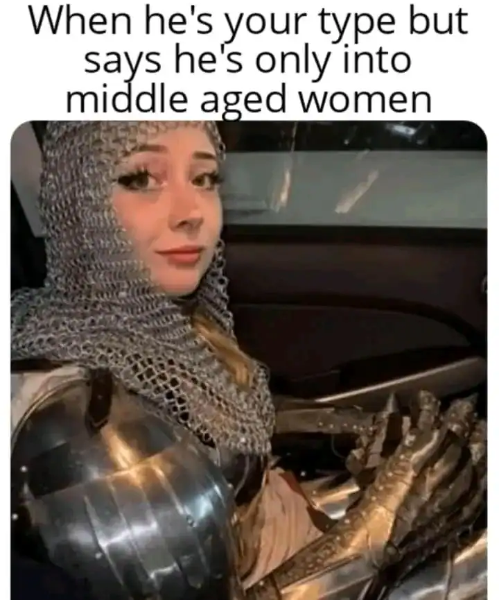 A medieval-themed dad joke featuring a woman in full chainmail and plate armor sitting in a car. The caption reads: "When he's your type but says he's only into middle aged women," using the term "middle aged" to refer to the Middle Ages rather than biological age.