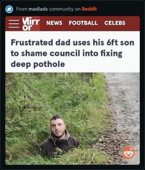 News headline screenshot from Reddit's madlads community about a frustrated father using his 6ft son as a human measuring stick. The photo shows the son standing in a massive, grass-filled pothole that reaches up to his armpits to illustrate the extreme depth of the road damage.