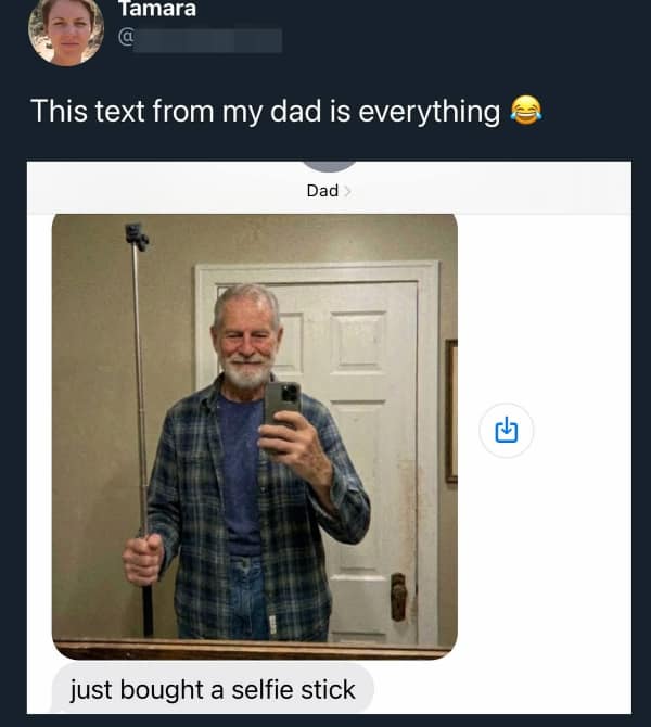 A mirror selfie shared on Twitter showing an older man in a blue plaid flannel shirt holding a long extendable metal pole like a walking staff. The text message below the photo reads "just bought a selfie stick," showing him completely misunderstanding how to mount his phone.